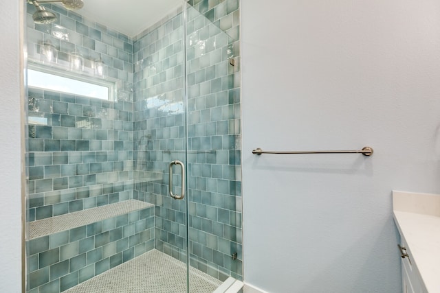 bathroom featuring vanity and an enclosed shower