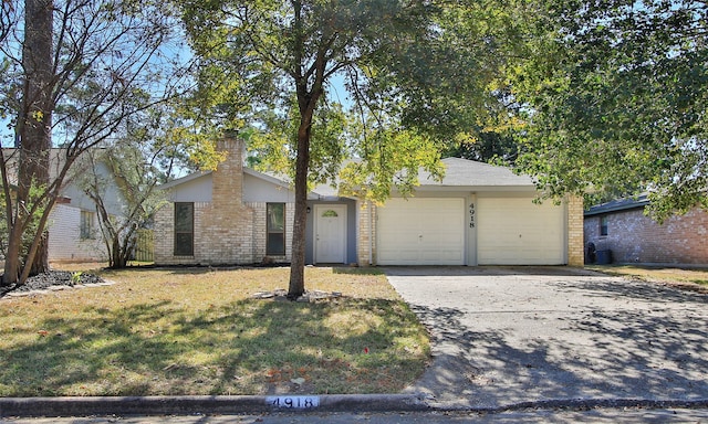 ranch-style home with a front yard and a garage