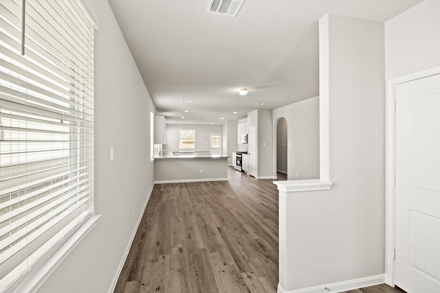 corridor with dark wood-type flooring