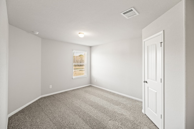 empty room featuring carpet flooring