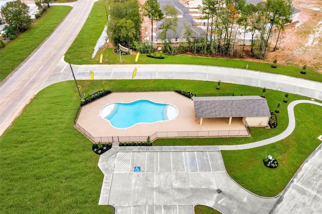 view of pool featuring a patio area and a lawn