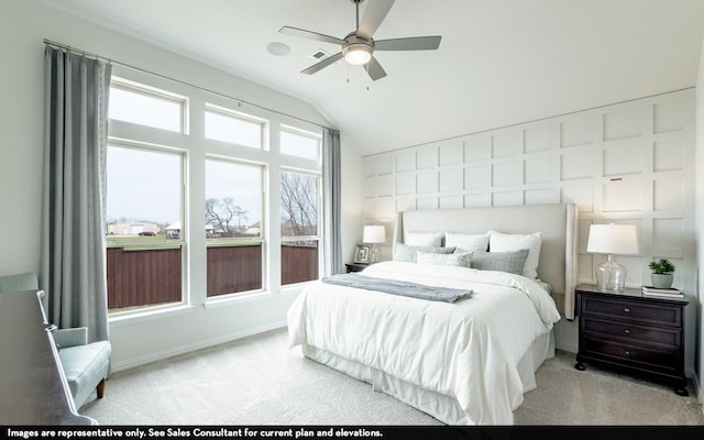 bedroom with carpet floors, baseboards, and lofted ceiling
