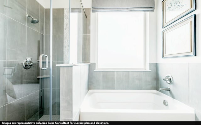 full bath with a bathtub and a shower stall