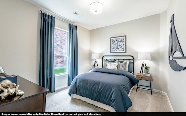 bedroom featuring carpet floors, baseboards, visible vents, and multiple windows