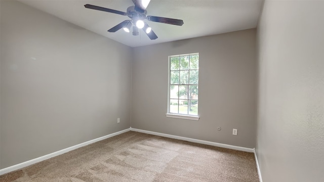 spare room with light carpet and ceiling fan