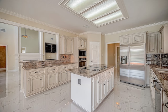 kitchen with decorative backsplash, a kitchen island, stone countertops, and stainless steel appliances