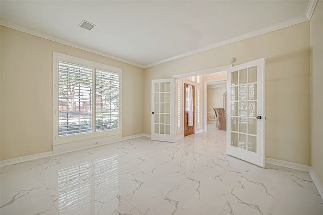 spare room featuring french doors and ornamental molding