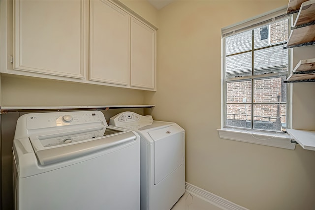 laundry area with cabinets and independent washer and dryer