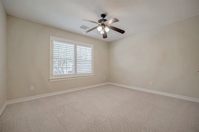 unfurnished room featuring carpet and ceiling fan