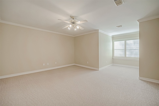 carpeted empty room featuring ceiling fan and crown molding