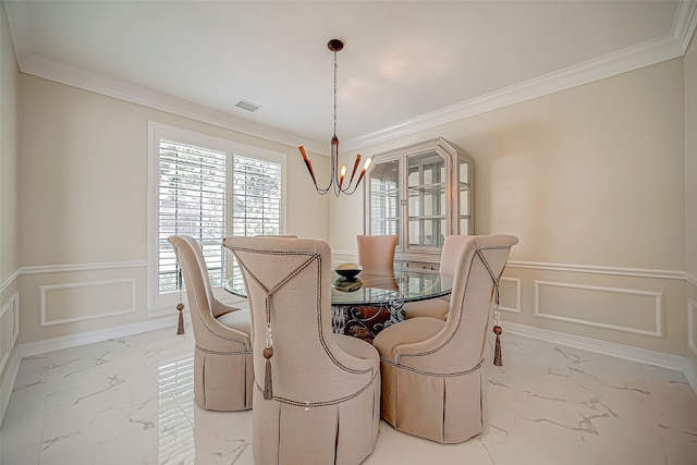 dining room with crown molding and a notable chandelier