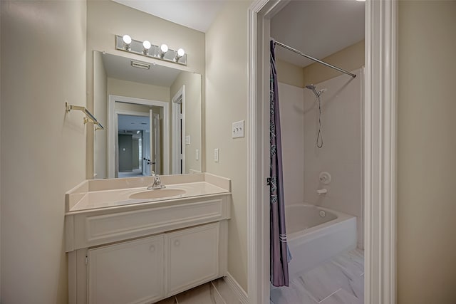 bathroom featuring vanity and shower / bathtub combination with curtain