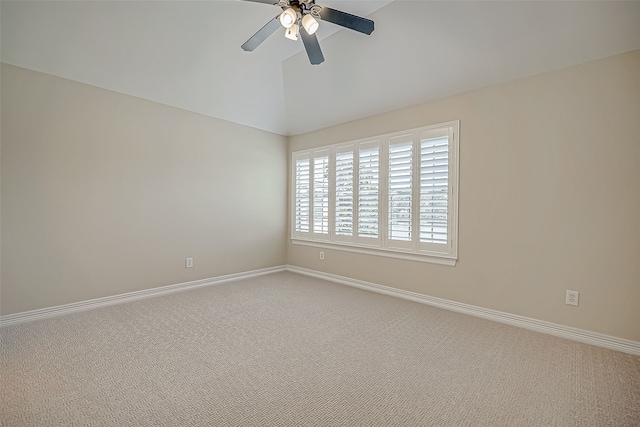 spare room with carpet, ceiling fan, and vaulted ceiling