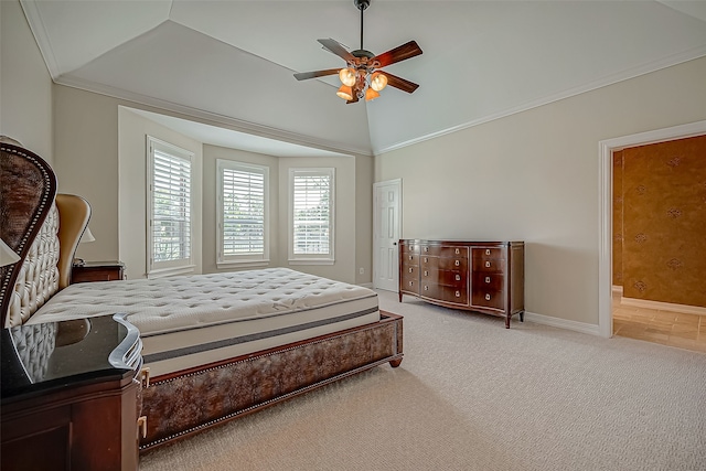 bedroom with connected bathroom, ceiling fan, carpet, and vaulted ceiling