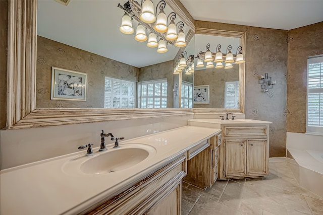 bathroom with vanity and a bath