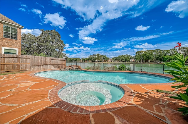 view of swimming pool featuring an in ground hot tub