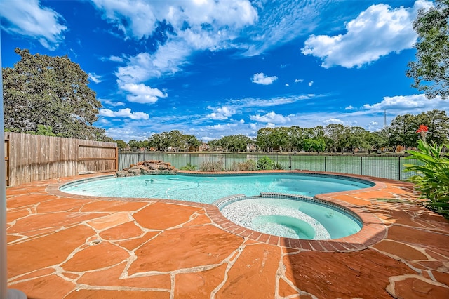 view of pool with an in ground hot tub