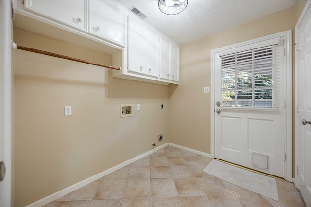 laundry area featuring hookup for a washing machine, hookup for a gas dryer, cabinet space, electric dryer hookup, and baseboards