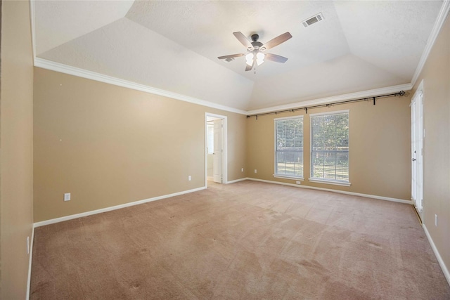 unfurnished room featuring baseboards, light colored carpet, visible vents, and crown molding