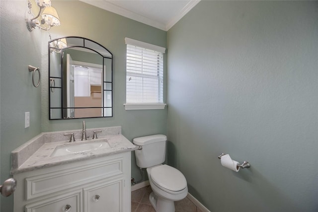 bathroom featuring toilet, tile patterned flooring, crown molding, and vanity