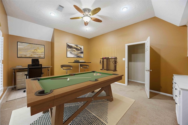 game room featuring a textured ceiling, ceiling fan, vaulted ceiling, and light carpet