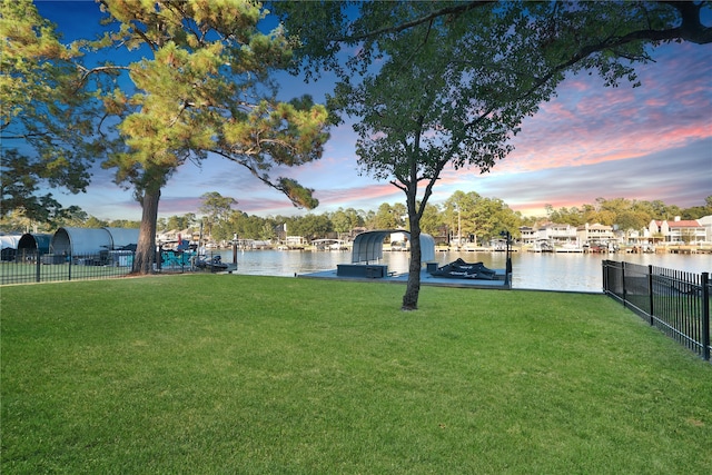 yard at dusk with a water view