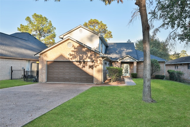 view of front of house with a front yard and a garage