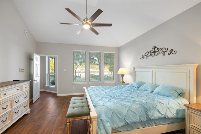 bedroom featuring dark hardwood / wood-style flooring, vaulted ceiling, and ceiling fan