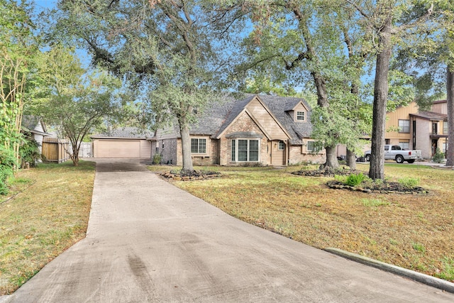 view of front of house featuring a front yard and a garage