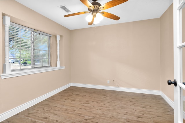 empty room with light hardwood / wood-style flooring and ceiling fan