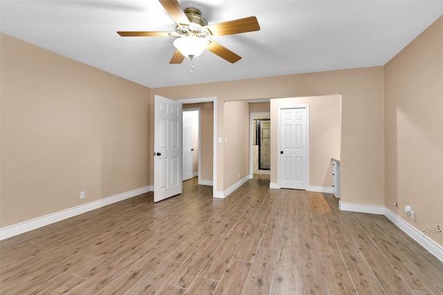 unfurnished bedroom with light hardwood / wood-style floors and ceiling fan