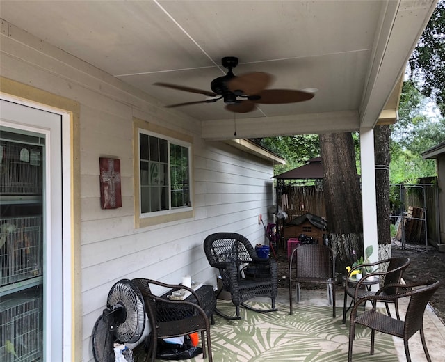 view of patio featuring ceiling fan