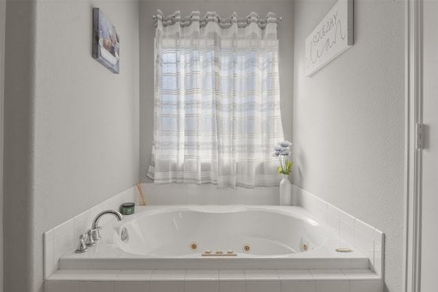 bathroom with a relaxing tiled tub