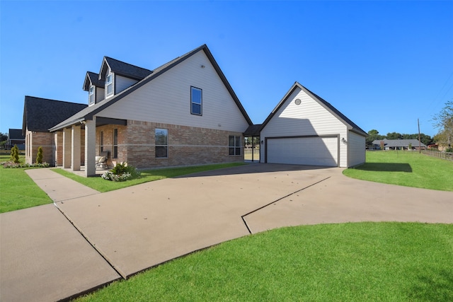 exterior space with a yard, an outdoor structure, and a garage