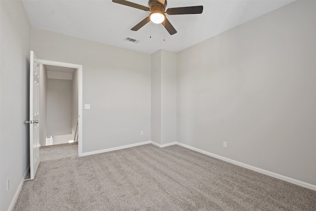 carpeted empty room with ceiling fan