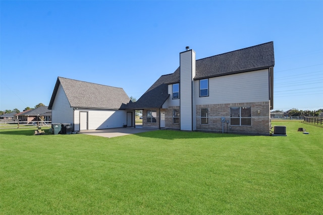 back of house featuring a yard, cooling unit, and a patio area