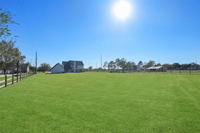 view of yard with a rural view