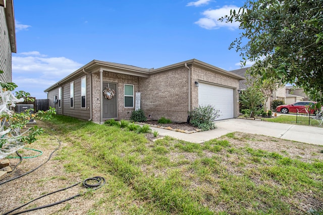 ranch-style house featuring a front lawn and a garage