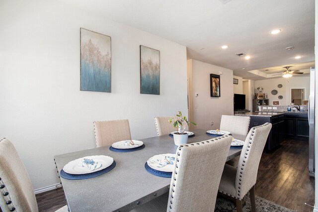 dining room featuring dark wood-type flooring and ceiling fan