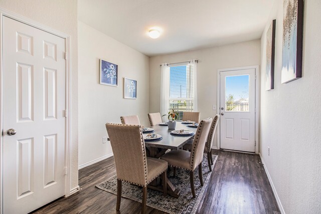 dining room with dark hardwood / wood-style floors