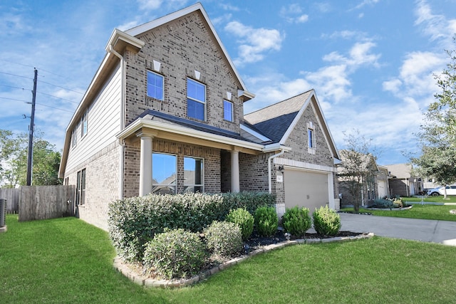 view of front of property featuring a garage, a front lawn, and central air condition unit