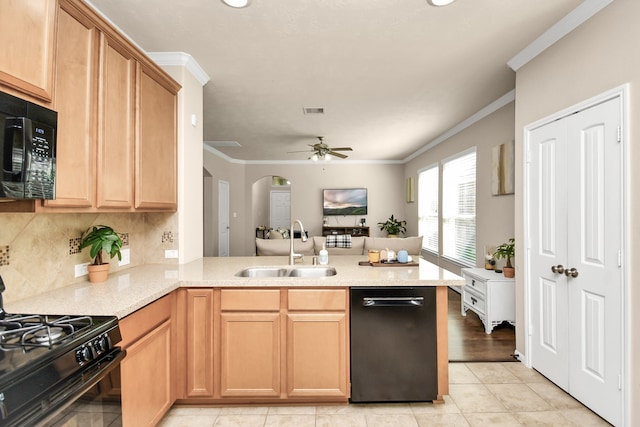 kitchen with sink, black appliances, kitchen peninsula, and ornamental molding