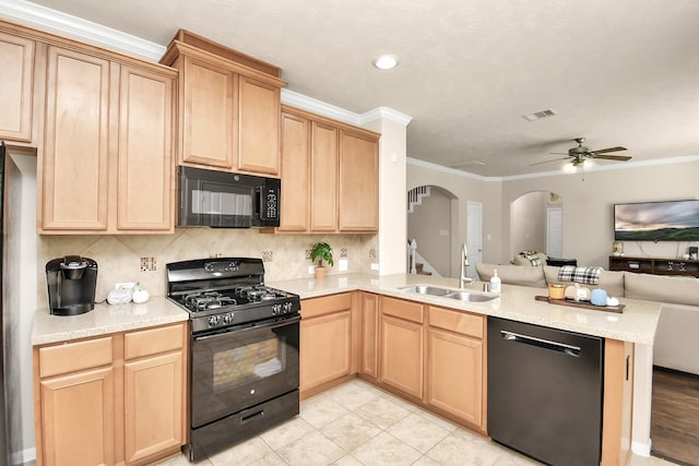 kitchen with black appliances, sink, kitchen peninsula, ceiling fan, and ornamental molding