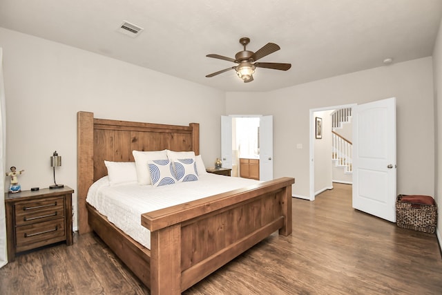 bedroom featuring dark hardwood / wood-style floors, connected bathroom, and ceiling fan