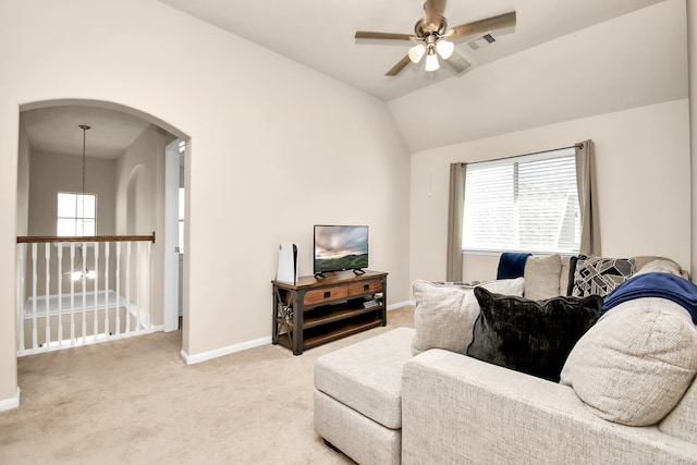 living room featuring carpet, vaulted ceiling, and ceiling fan