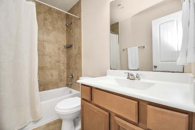 full bathroom featuring vanity, shower / tub combo, and toilet