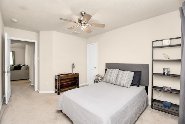 bedroom with light carpet and ceiling fan