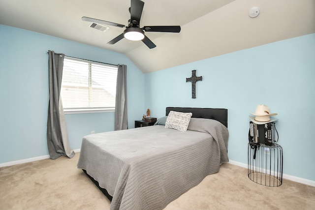 bedroom featuring ceiling fan, light carpet, and lofted ceiling