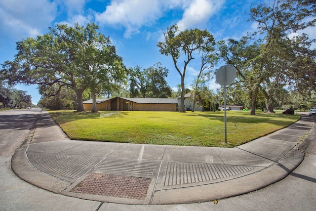 exterior space featuring a front yard