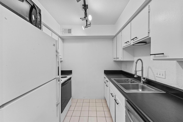 kitchen with white cabinetry, sink, light tile patterned floors, and white appliances